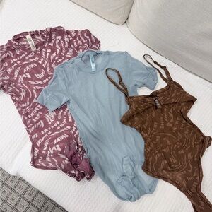Skims- Set of Three Mesh Bodysuits in Purple, Blue, and Brown - M